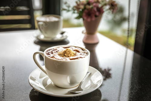 Hot Mocha Coffee in a cup on black table.