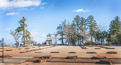 Canvas Print Stone and ruines of the old Sendai Aoba Castle with Masamune monument in the background