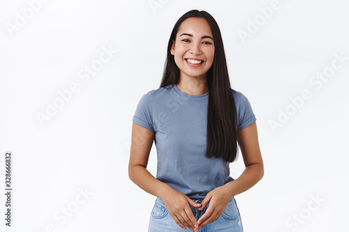 Принти на полотні Attractive tender young asian woman with long healthy dark hair, clasp hands tog