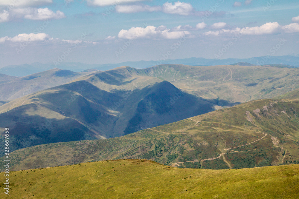 Obraz premium Carpathian Mountains landscape in Dragobrat. Gendarmes mountains on the Svydovets ridge. The Svydovets is a mountain range in western Ukraine belonging to the Outer Eastern Carpathians. 