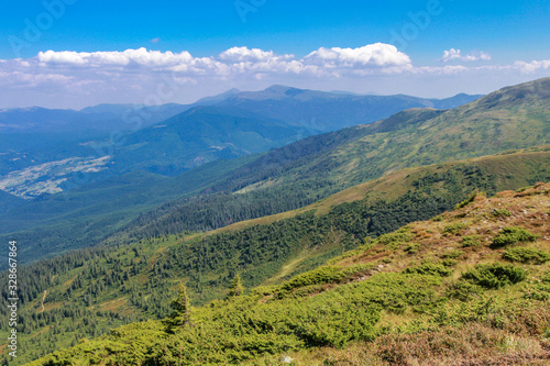 Carpathian Mountains. View of the Chornohora Range and Mount Hoverla and Petros. Carpathian landscape on a sunny summer day. Beautiful sunny day is in mountain landscape. Carpathian, Ukraine.