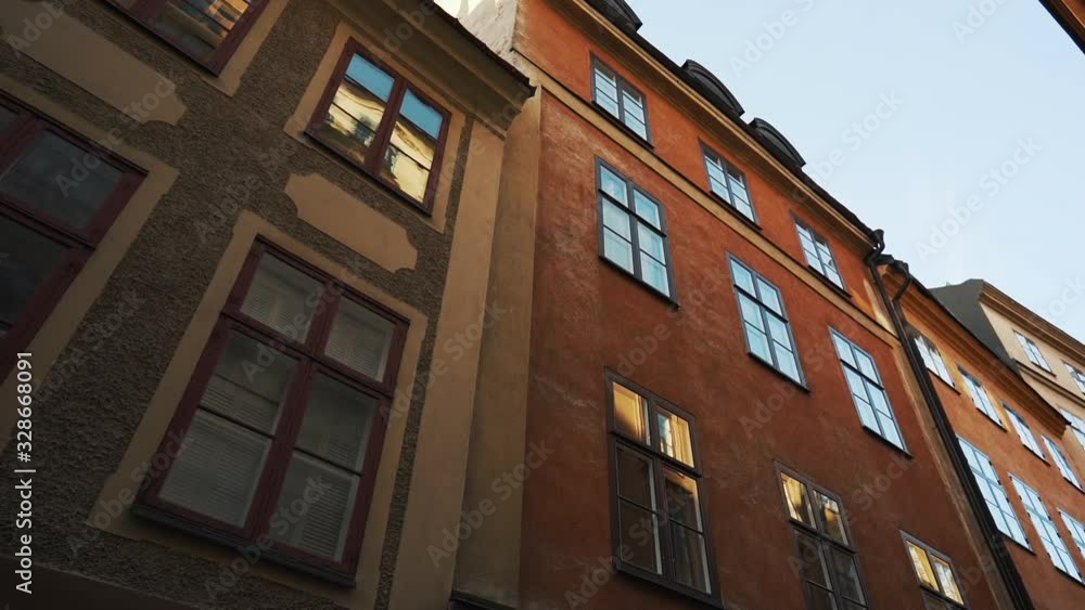 Apartment building streets in old northern european city. Scandinavian windows. Facades of colorful houses in the streets of Sweden. Traveling concept. Slow motion. Steadicam shot Apartment building streets in old northern european city. Scandinavian windows. Facades of colorful houses in the streets of Sweden. Traveling concept. Slow motion. Steadicam shot