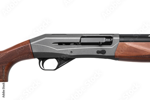Closeup shotgun shutter. Hunting semi-automatic shotgun with wooden butt isolate on white back © solidmaks