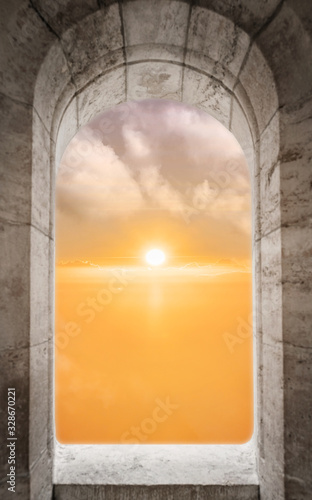 Looking through castle window frame with sunrise view