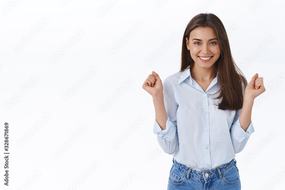 Girl feeling how success coming to her hands, relish concept. Cheerful successful and lucky adult woman do champion dance from anticipation of good news, triumphing smiling broadly Girl feeling how success coming to her hands, relish concept. Cheerful successful and lucky adult woman do champion dance from anticipation of good news, triumphing smiling broadly