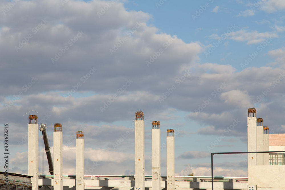 Concept of new construction in a background of the blue sky. Concept of new construction in a background of the blue sky.