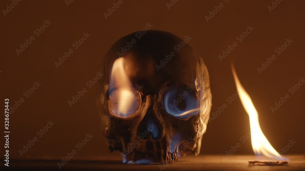 Burning human skull closeup photo Burning human skull closeup photo