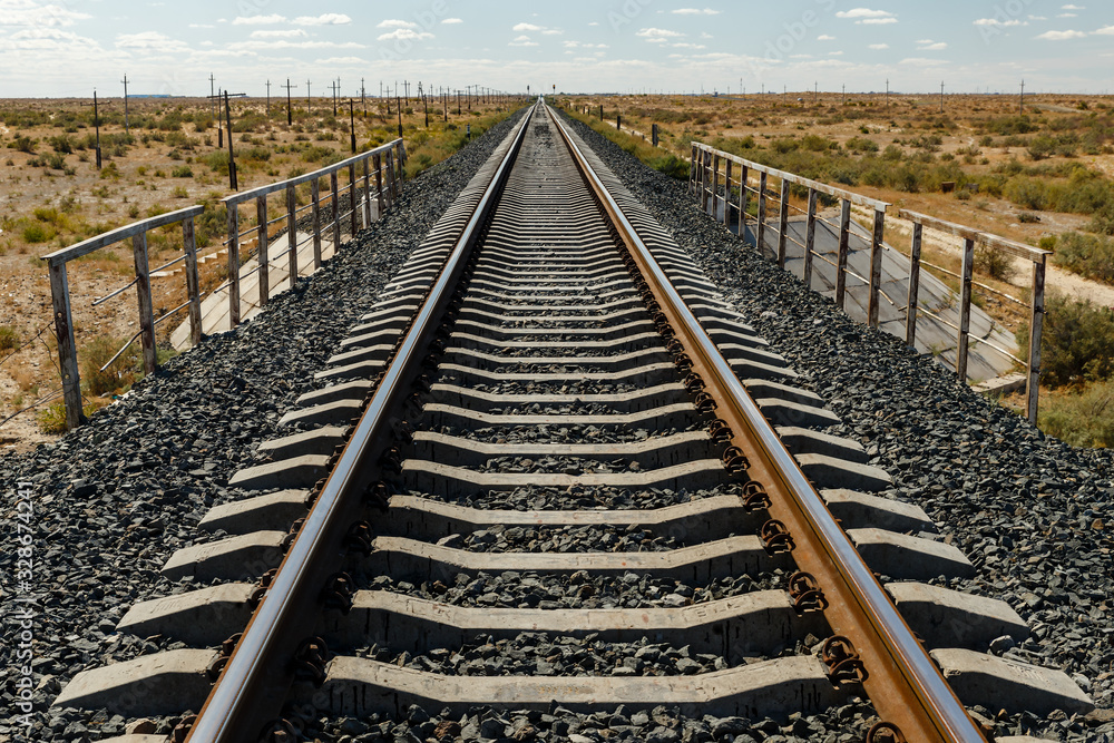 Fototapeta premium single track railway in the steppe of Kazakhstan