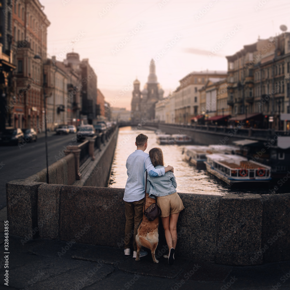 young couple enjoying the city view by the river young couple enjoying the city view by the river
