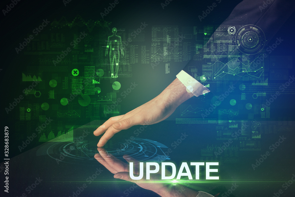 Businessman touching huge display with UPDATE inscription, modern technology concept Businessman touching huge display with UPDATE inscription, modern technology concept