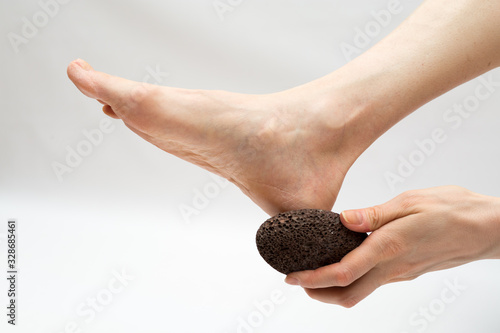 Принти на полотні dry massage with a pumice stone.  foot care