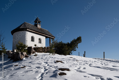 Church in the snow in the bavarian alps near Tegernsee