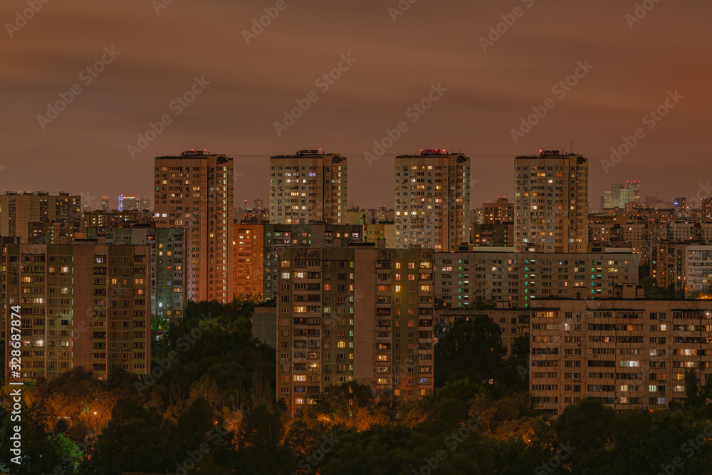 Moscow residential apartments night view, with bright orange lighting windows, Moscow, Russia