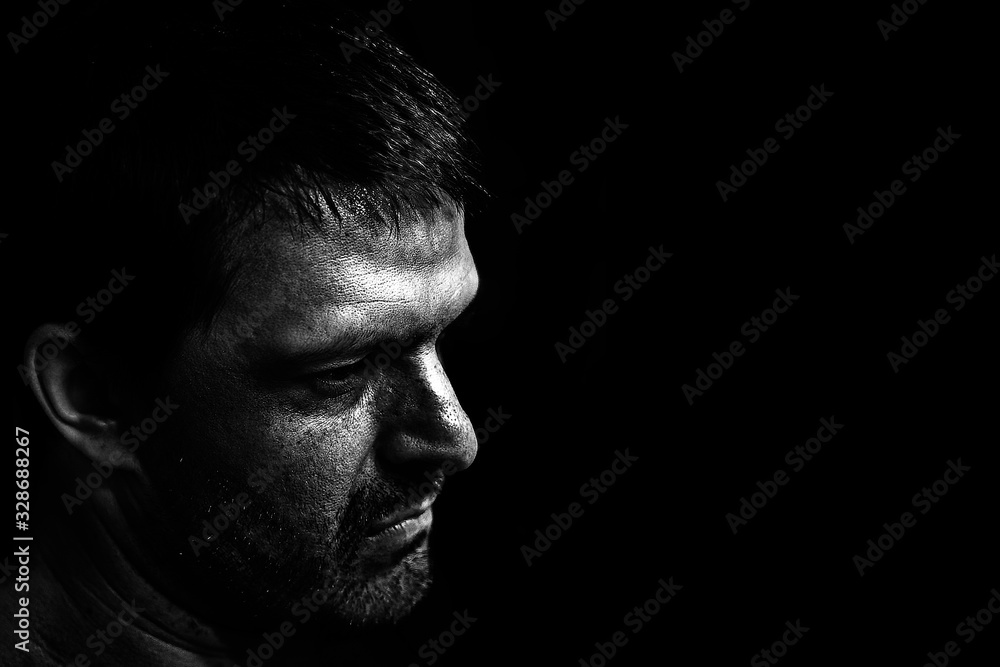 A man's angry face. A man with the look of a maniac.Terrible facial expression. A man's angry face. A man with the look of a maniac.Terrible facial expression.