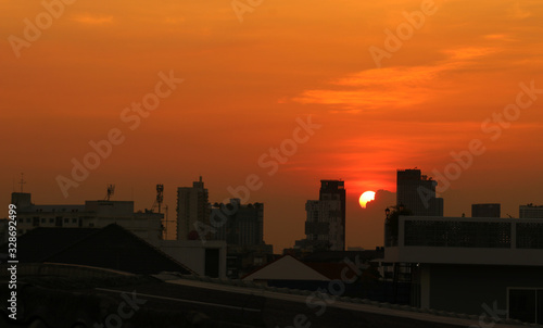 sunset in the city © Kamphol
