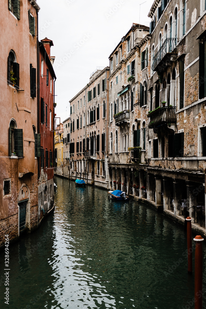 View of the rustic architecture of Venice, Italy canal alley 
