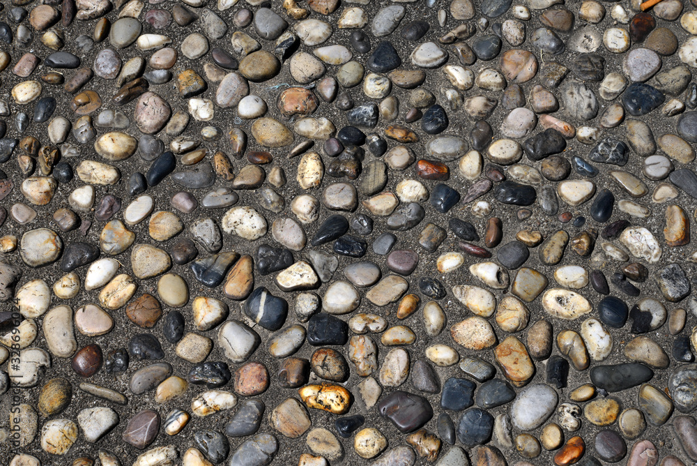 Close up of Park sidewalk paved with pebbles Close up of Park sidewalk paved with pebbles