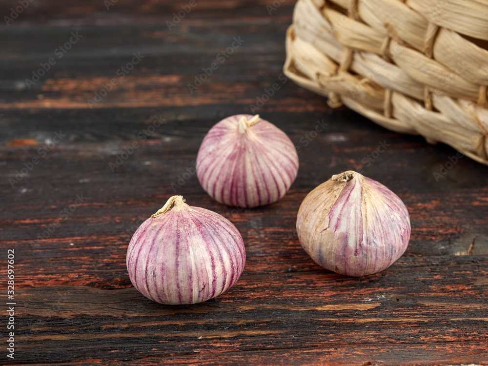 Fototapeta premium Fresh garlic on market table closeup photo