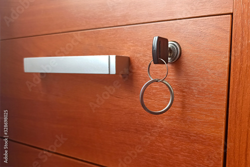 The desk drawer is locked. Key table in the keyhole. Concept: commercial secret, secret, confidentiality, judicial and medical secret.
