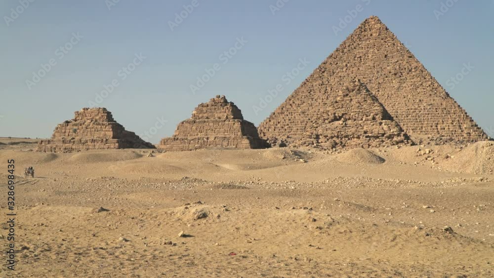 The Pyramid of Menkaure with three subsidiary pyramids, located on the Giza Plateau in greater Cairo, Egypt The Pyramid of Menkaure with three subsidiary pyramids, located on the Giza Plateau in greater Cairo, Egypt