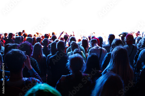 crowd of fans at a concert in front of the stage, a lot of people look at the stage