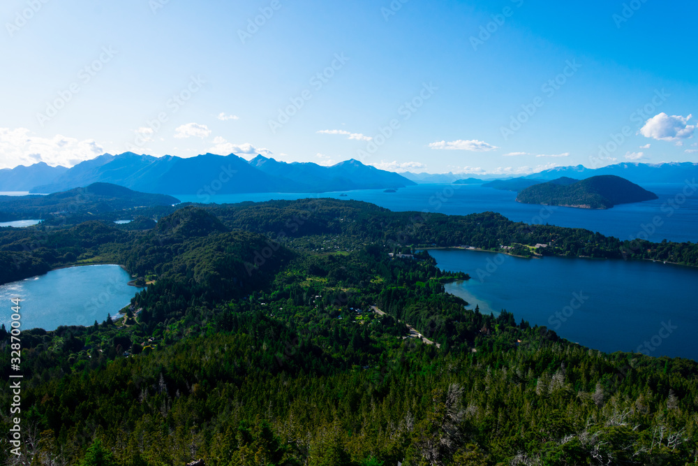 View of El Trebol Lagoon, Nahuel Huapi Lake and the mountains taken from Mount Campanario viewpoint (Cerro Campanario). Bariloche, Argentina