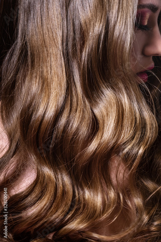 Luxurious long curls, shiny and healthy hair
