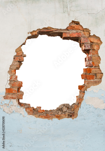 Broken hole in an old brick wall photo
