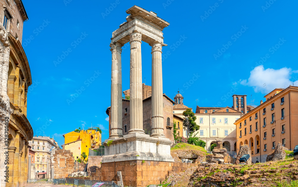 Antique architecture of Rome. Ancient columns at the site of the ruins. above famous architectural landmark.