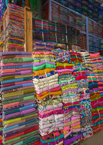 Stacks of Colorful Fabrics