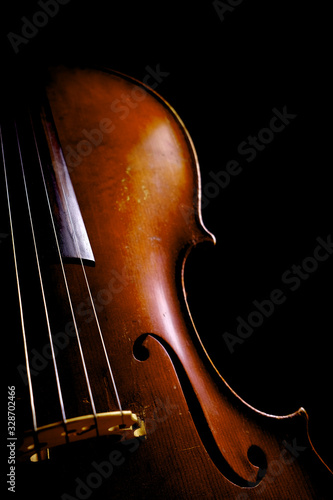 Vintage cello on a dark background. Cello details.