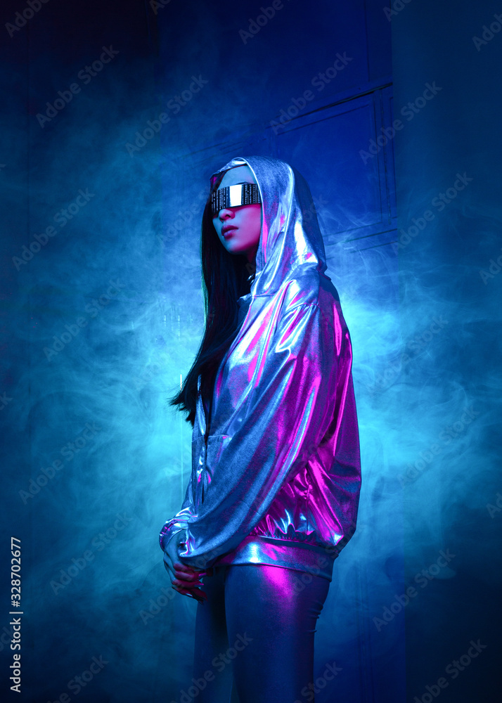 Neon portrait of a girl of Asian appearance dressed in futuristic