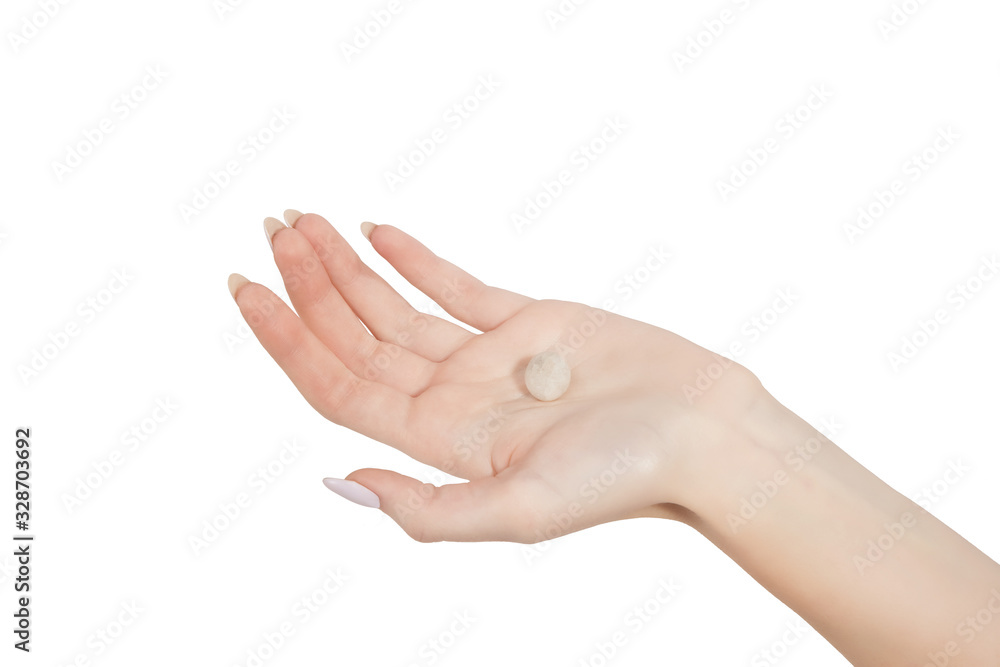 the femalthe female hand derzhderzhit a small stone is isolated on a white 