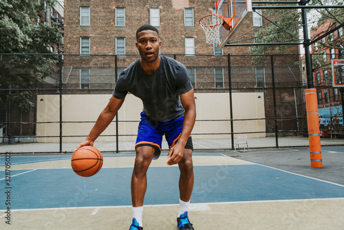 Basketball player training on a court in New york city © oneinchpunch
