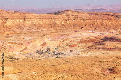 Crater cliffs mountain in Negev desert. Mineral fertilizer plant. Makhtesh HaGadol. Israel 