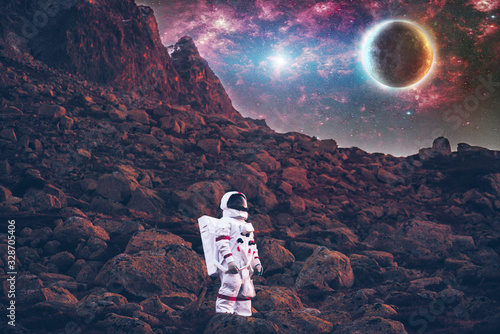 Astronaut exploring a new planet. Searching for a new home for humanity. Concept about science and nature photo