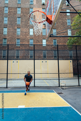 Basketball player training on a court in New york city