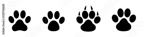 Paw print set. Paw foot trail print of animal. Dog, cat, bear, puppy silhouette. Collection of paw prints. Different animal paw - stock vector. photo