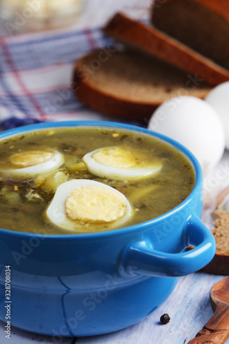 A bowl with homemade sorrel soup 