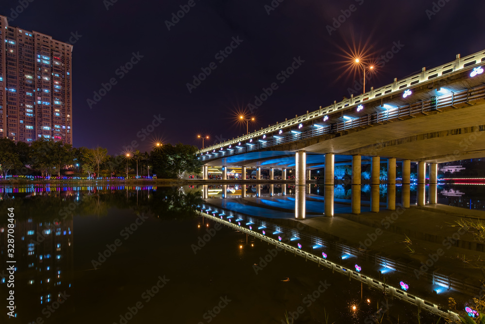A bridge of decorative lights in the night