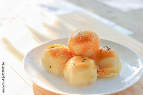 Chinese pastry or moon cake filled with mung bean paste and salted egg yolk