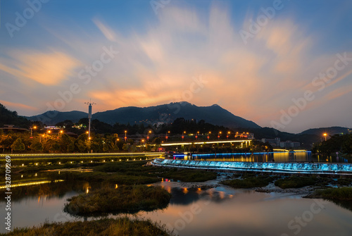 Artificial lakes, pavilions and running water in the setting sun © chen