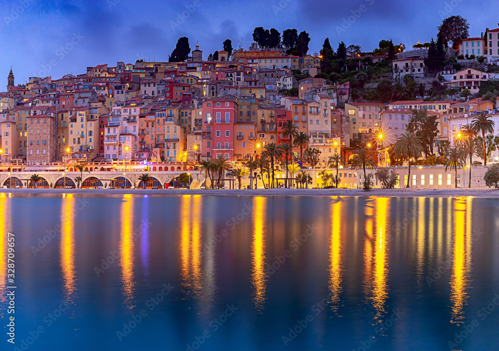 Fototapeta premium Menton. Antique multi-colored facades of medieval houses on the shore of the bay.