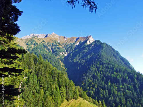 View of the picturesque peaks of the Ratikon border alpine mountain massif or Rätikon Grenzmassiv (oder Raetikon), Mainfeld - Canton of Grisons (Graubünden or Graubuenden), Switzerland photo