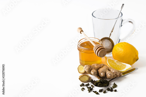 Tea with ginger, honey and lemon on white background. Isolated. close up, copy space
