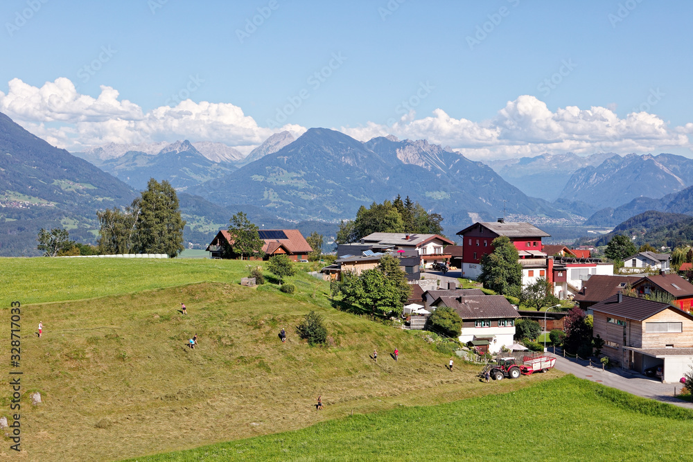 Farmers in Alpine village Amerluegen