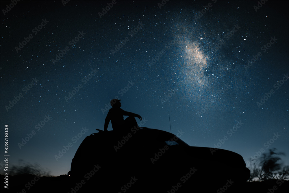 car on the background of the night sky in the desert