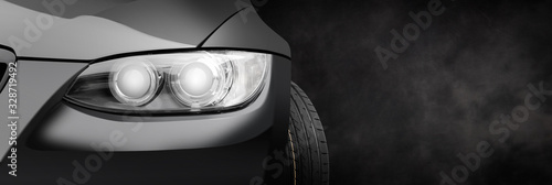 Naklejka Car headlight on a black dark background