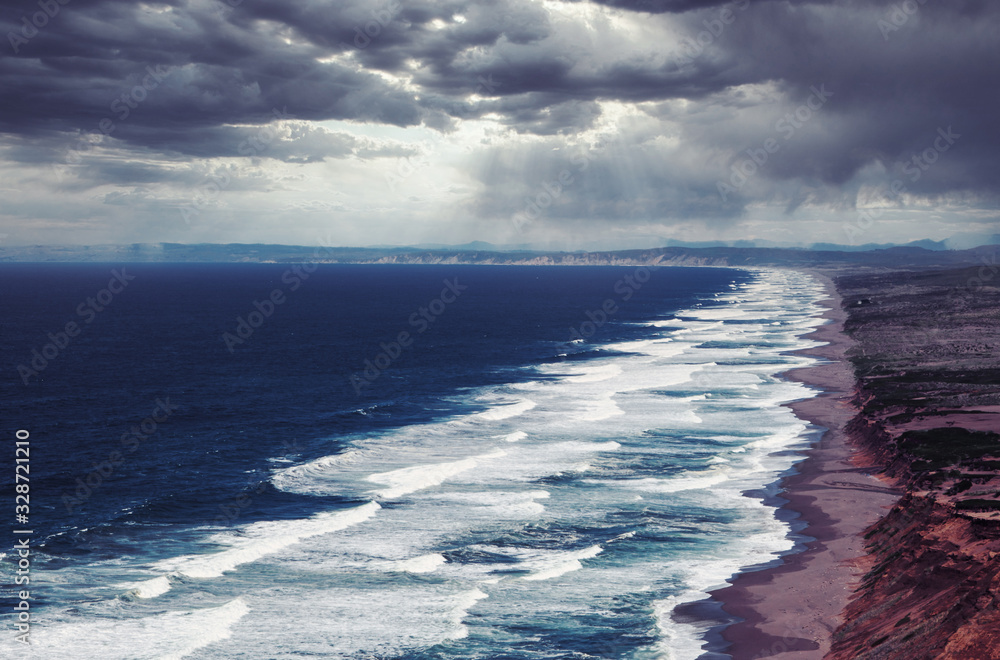 panoramic view of coastline in California with cloudy sky