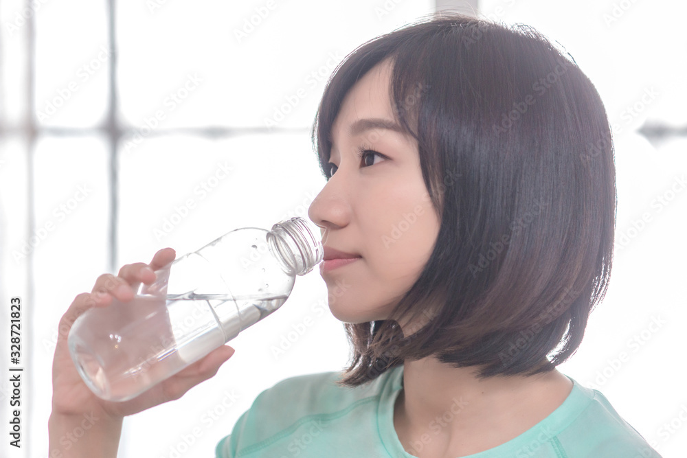 young attractive asian woman who drinks water young attractive asian woman who drinks water